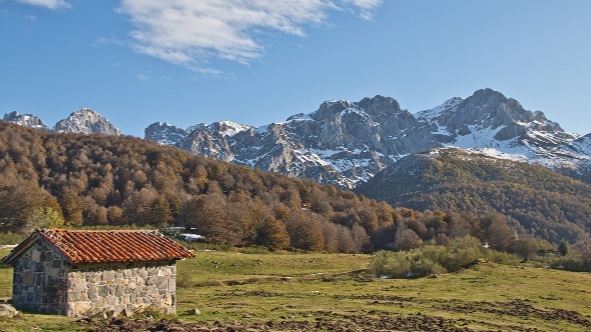 Shepherds huts and snowy peaks Picos de Europa