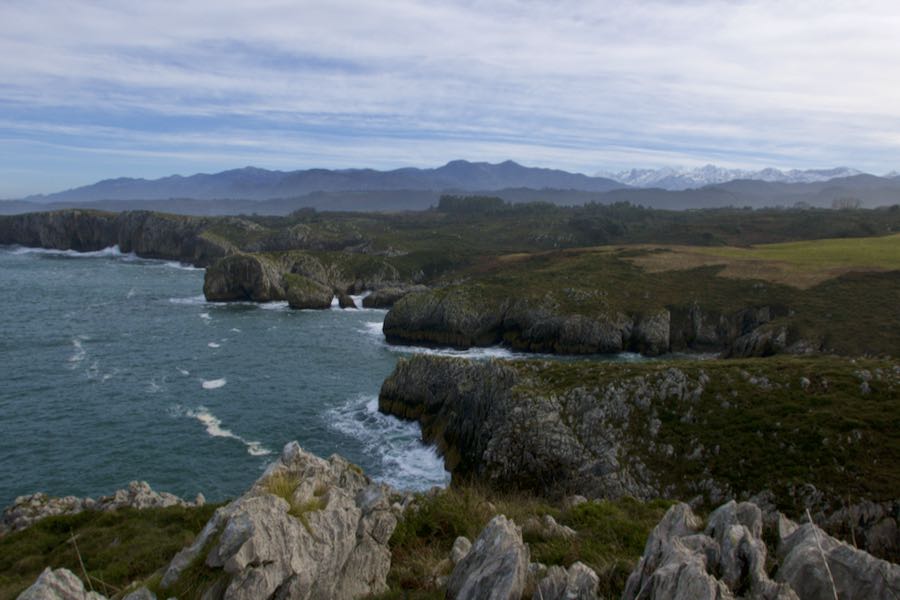 Playa de Cuevas with Picos de Europa views